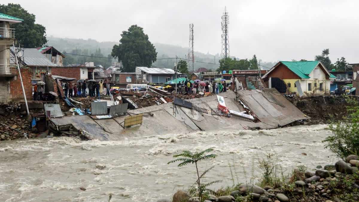 Flash floods swept away a shopping complex at Beerwah, in Budgam on Wednesday. (ani)