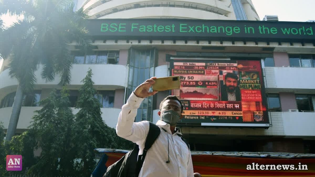 A man clicks a selfie in front of digital screen outside the Bombay Stock Exchange (BSE) in Mumbai on Feb 24, 2022. (ANI)