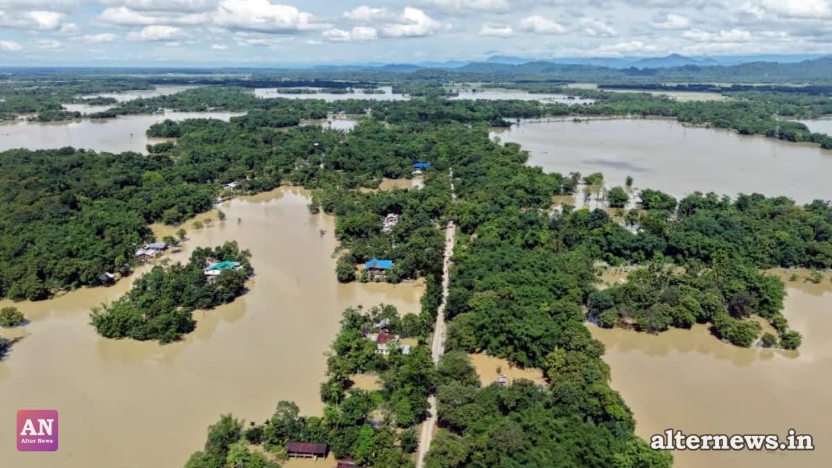 An aerial view of vast stretches of flooded areas with houses and villages submerged amid the severe Assam floods, in Sivasagar on July 22, 2026. (ANI)