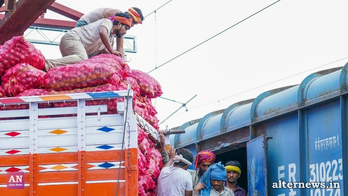 Workers load sacks of onions onto a truck from a freight train at Adarsh Nagar Railway Station, in New Delhi on Friday, August 28, 2026. (IANS)