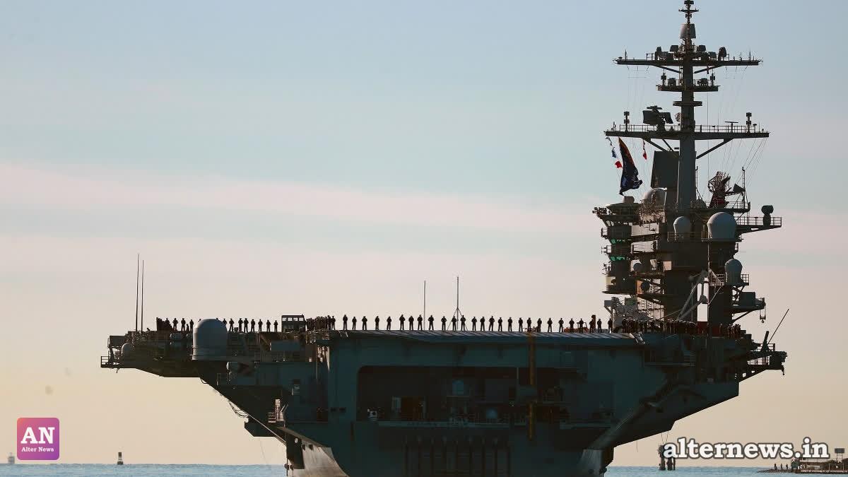 Sailors and Marines line the deck of aircraft carrier USS Abraham Lincoln (CVN-72) (File/AP)