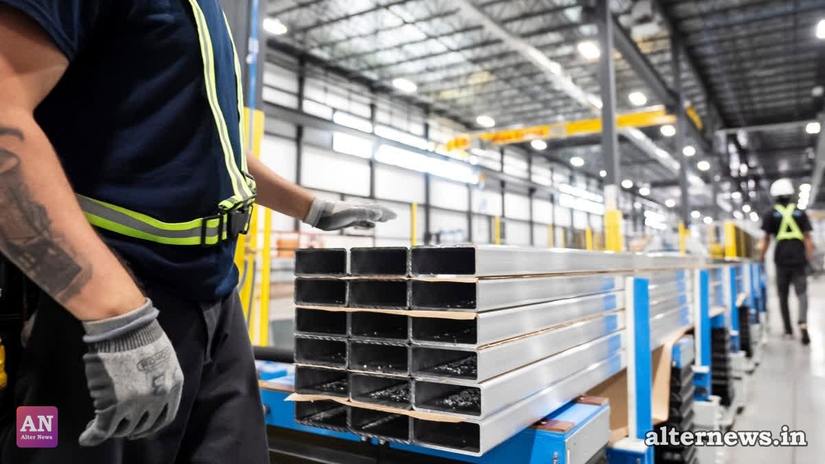 Workers prepare extruded aluminum product for packaging at Magna Aluminum Profile's fully electric powered extrusion facility in Salaberry-de-Valleyfield, Quebec, Canada. (File/AP)