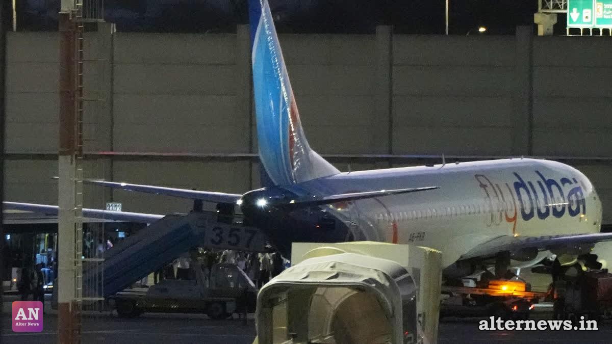 People disembark from a FlyDubai carrying Israeli passengers who had earlier been aboard another FlyDubai aircraft that made an emergency landing in Saudi Arabia approaches Ben Gurion International Airport near Tel Aviv, Israel, Wednesday (AP)